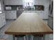 Large kitchen island with butcher block countertop at 155 Carriage Gate Dr, Sharpsburg, GA 30277