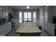 Kitchen with island and white cabinets at 155 Carriage Gate Dr, Sharpsburg, GA 30277