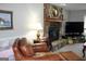 Comfortable living room with leather chairs and fireplace at 155 Carriage Gate Dr, Sharpsburg, GA 30277