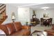 Spacious living area with seating, dining, and stairs at 155 Carriage Gate Dr, Sharpsburg, GA 30277