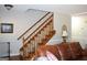 Wooden staircase with carpeted steps and railing at 155 Carriage Gate Dr, Sharpsburg, GA 30277