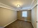 Spacious bedroom with new carpet and crown molding at 157 Ruzelle Se Dr, Atlanta, GA 30354