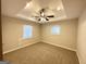 Main bedroom with ceiling fan and two windows at 157 Ruzelle Se Dr, Atlanta, GA 30354