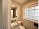 Clean bathroom with granite countertop and block glass window at 60 Oak Sw Dr, Atlanta, GA 30354