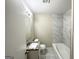 Updated bathroom with granite vanity and marble tile at 60 Oak Sw Dr, Atlanta, GA 30354