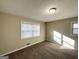 Bright bedroom with neutral carpet and two windows at 60 Oak Sw Dr, Atlanta, GA 30354