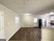 Open dining area with hardwood floors and access to kitchen at 60 Oak Sw Dr, Atlanta, GA 30354