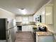 Modern kitchen with granite countertops and stainless steel appliances at 60 Oak Sw Dr, Atlanta, GA 30354