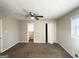 Main bedroom with ceiling fan and ensuite bathroom access at 60 Oak Sw Dr, Atlanta, GA 30354