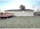 House exterior showcasing a wooden deck and a large backyard at 6595 Bellburn Rd, Atlanta, GA 30349