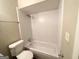 Bathroom with a shower and a white tiled wall at 6595 Bellburn Rd, Atlanta, GA 30349