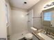Updated bathroom with a shower/tub combo and granite vanity at 6595 Bellburn Rd, Atlanta, GA 30349