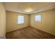 Bedroom with neutral decor, carpet, and two windows at 6595 Bellburn Rd, Atlanta, GA 30349