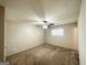 Primary bedroom with ceiling fan and neutral color scheme at 6595 Bellburn Rd, Atlanta, GA 30349