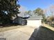 House exterior showcasing a gray brick finish and a single-car garage at 6595 Bellburn Rd, Atlanta, GA 30349