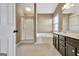 This bathroom features a shower, a bathtub, and a double sink vanity at 704 Pine Grove Cir, Peachtree City, GA 30269
