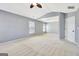 The bedroom is carpeted and has natural light from the windows at 704 Pine Grove Cir, Peachtree City, GA 30269