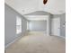An empty bedroom with lots of space, carpet, and natural light at 704 Pine Grove Cir, Peachtree City, GA 30269