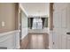 Elegant dining room with decorative trim, hardwood floors, and bright natural light at 704 Pine Grove Cir, Peachtree City, GA 30269