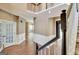 Expansive foyer featuring hardwood floors, staircase, french doors, and natural light at 704 Pine Grove Cir, Peachtree City, GA 30269