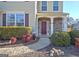 Charming front entrance with stone accents, well-maintained landscaping, and a curved walkway at 704 Pine Grove Cir, Peachtree City, GA 30269