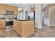 Kitchen featuring stainless appliances, center island, and granite countertops at 704 Pine Grove Cir, Peachtree City, GA 30269