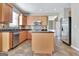 Kitchen with wood cabinets, stainless steel appliances and decorative backsplash at 704 Pine Grove Cir, Peachtree City, GA 30269