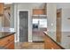 Kitchen area with stainless steel refrigerator and black paneled door at 704 Pine Grove Cir, Peachtree City, GA 30269