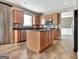 Kitchen featuring stainless steel appliances, a kitchen island, and granite countertops at 704 Pine Grove Cir, Peachtree City, GA 30269