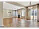 Open-concept living space featuring tile floors, a fireplace, and access to the backyard at 704 Pine Grove Cir, Peachtree City, GA 30269