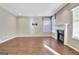 Living room with fireplace and multiple windows at 704 Pine Grove Cir, Peachtree City, GA 30269