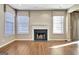 Living room featuring a fireplace and lots of natural light at 704 Pine Grove Cir, Peachtree City, GA 30269