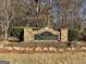 Stone community sign: Chadsworth at Ashton Reserve, with lush landscaping and mature trees at 704 Pine Grove Cir, Peachtree City, GA 30269