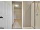 A walk-in closet off the bathroom with shelving for storage at 704 Pine Grove Cir, Peachtree City, GA 30269