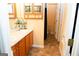 Double vanity bathroom with wood cabinets and large mirror at 756 Stonehaven Chase, Mcdonough, GA 30253