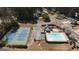 Aerial view of community pool, splash pad, gazebo, and tennis courts at 756 Stonehaven Chase, Mcdonough, GA 30253