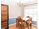 Charming dining area with wood table and lots of natural light at 756 Stonehaven Chase, Mcdonough, GA 30253