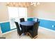Dining area with a round table and four black chairs at 756 Stonehaven Chase, Mcdonough, GA 30253