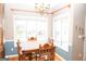 Bright dining room with a charming wood table and chair set at 756 Stonehaven Chase, Mcdonough, GA 30253