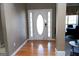 Front entry with hardwood floors and an oval door at 756 Stonehaven Chase, Mcdonough, GA 30253