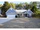 Ranch style home with white garage door and front porch at 756 Stonehaven Chase, Mcdonough, GA 30253