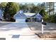 Blue house with driveway and mailbox at 756 Stonehaven Chase, Mcdonough, GA 30253