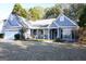 Blue house with front porch and landscaping at 756 Stonehaven Chase, Mcdonough, GA 30253