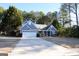 Front view of a charming blue house with a two-car garage at 756 Stonehaven Chase, Mcdonough, GA 30253