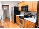 Kitchen with stainless steel appliances and wood cabinets at 756 Stonehaven Chase, Mcdonough, GA 30253