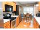 Eat-in kitchen with stainless steel appliances and wood cabinets at 756 Stonehaven Chase, Mcdonough, GA 30253