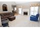 Open living room with a view into kitchen and fireplace at 756 Stonehaven Chase, Mcdonough, GA 30253