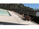 Community pool area featuring lounge chairs, tables, and chairs for residents to enjoy at 756 Stonehaven Chase, Mcdonough, GA 30253
