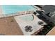 Aerial view of community pool and splash pad area with tables and chairs for residents at 756 Stonehaven Chase, Mcdonough, GA 30253