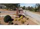 Community sign surrounded by landscaping and plants with brick column at 756 Stonehaven Chase, Mcdonough, GA 30253